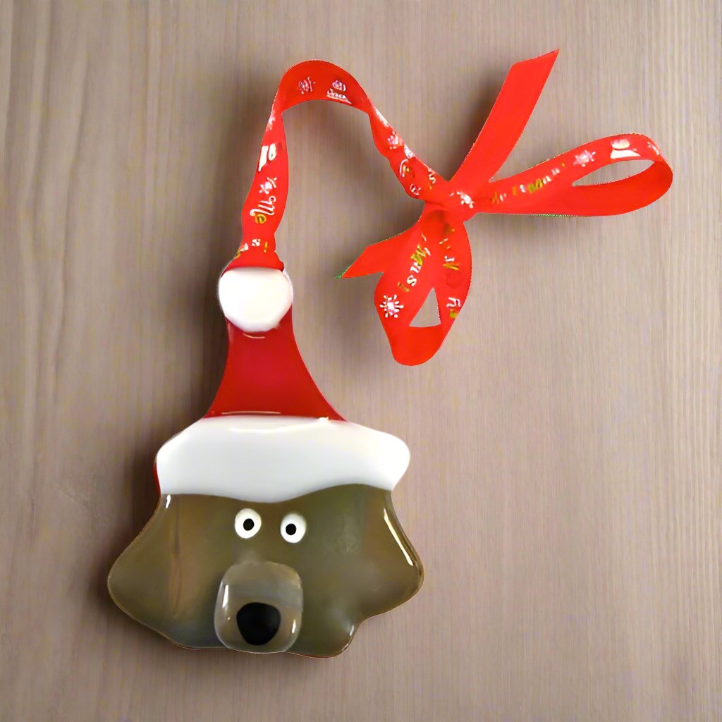 fused glass dog decoration with christmas hat