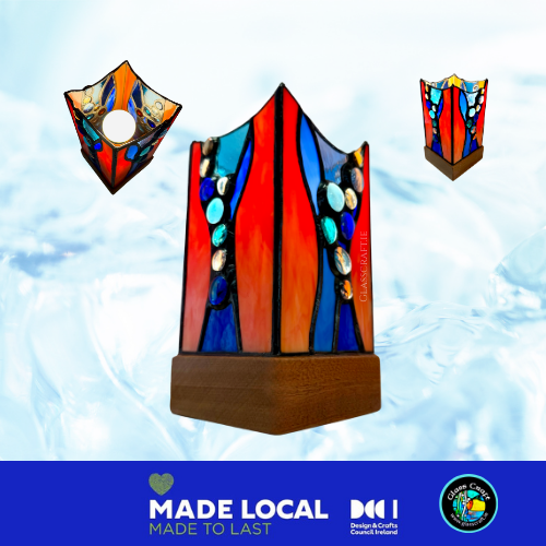 Colorful stained glass lamp with wooden base on a light blue background, featuring 'Made Local' branding.