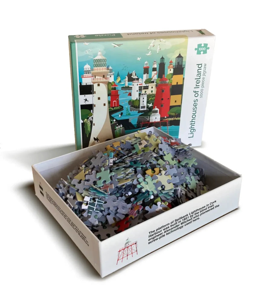 An open jigsaw puzzle box showing the assembled puzzle pieces inside, with the illustrated puzzle box standing behind it. The box reads 'Lighthouses of Ireland' and '5000 pieces'. blue moon gifts Duncannon Wexford