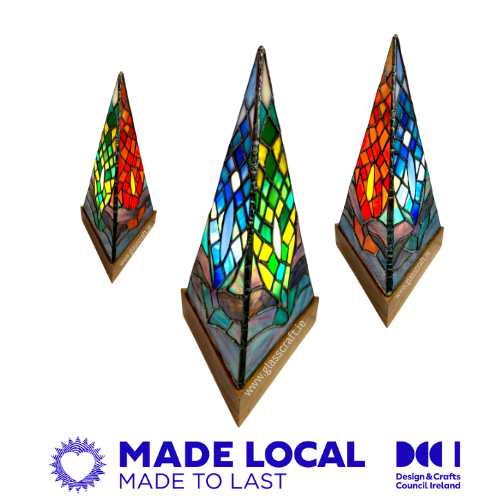 Three pyramid-shaped stained glass lamps on a white background with 'Made Local, Made to Last' and DCC logos.