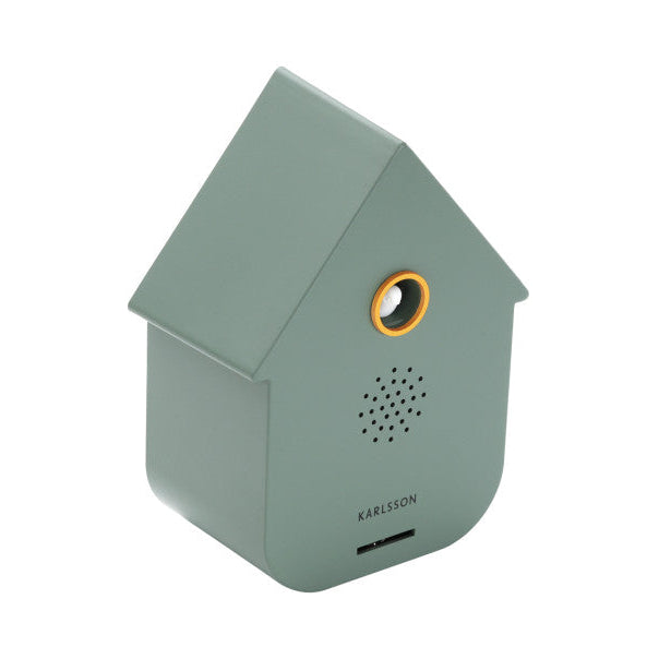 Green birdhouse-shaped speaker with 'KARLSSON' branding on a white background