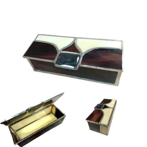 A unique bespoke jewellery box made from stained glass in shades of cream, red, and blue, with a piece of agate rock. The box is displayed open and closed.
